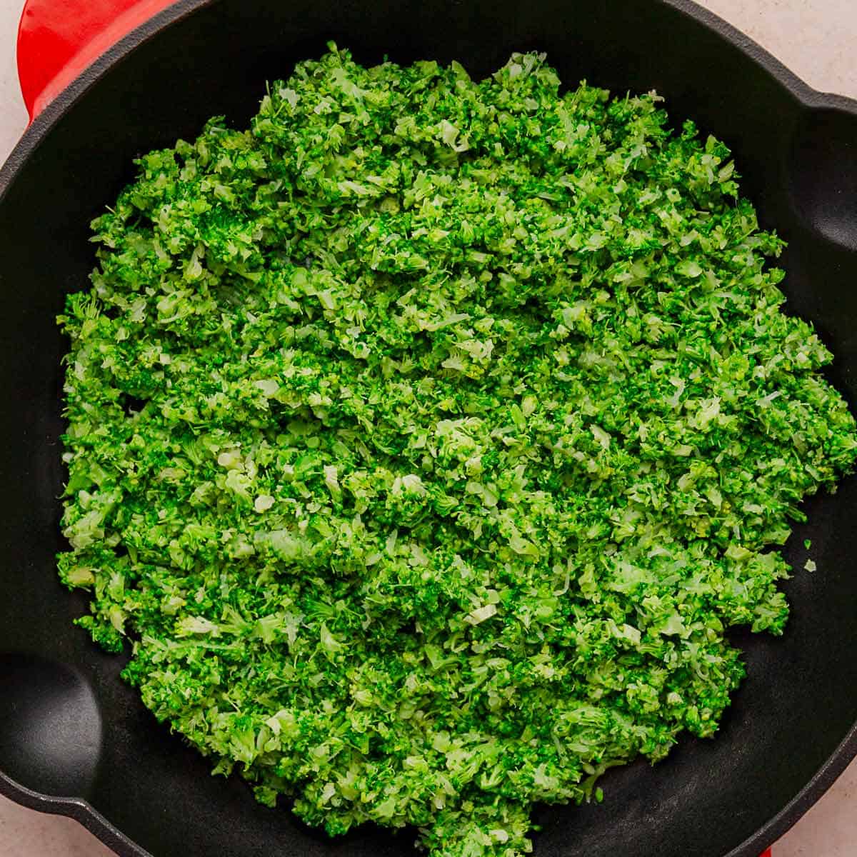 riced broccoli in skillet.