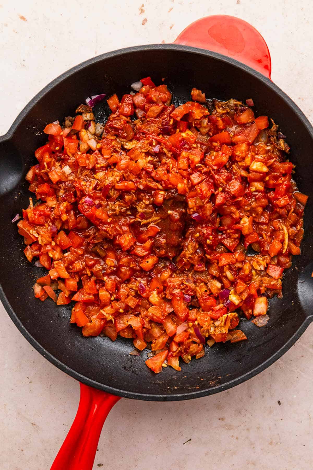 fried tomatoes in skillet.
