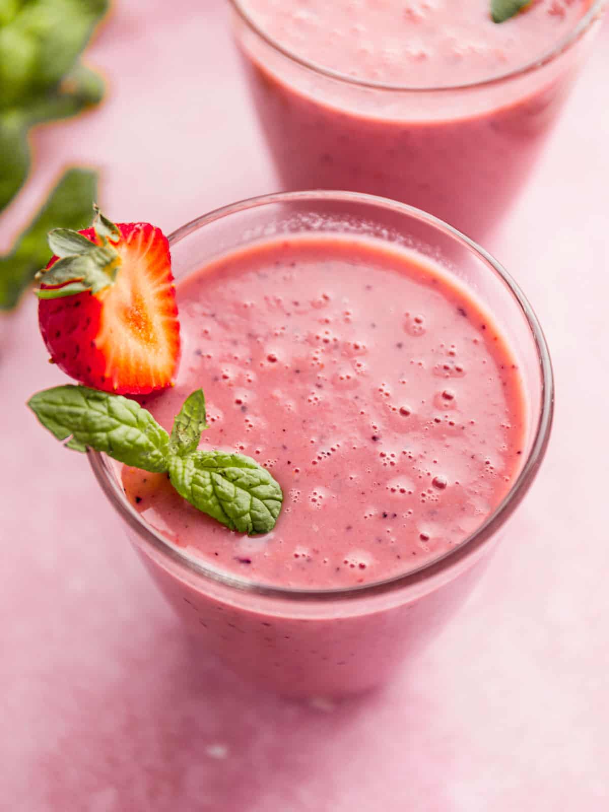 watermelon smoothie with strawberry garnish.