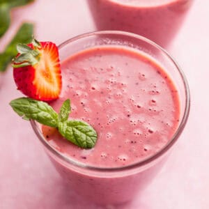 watermelon smoothie with strawberry garnish.