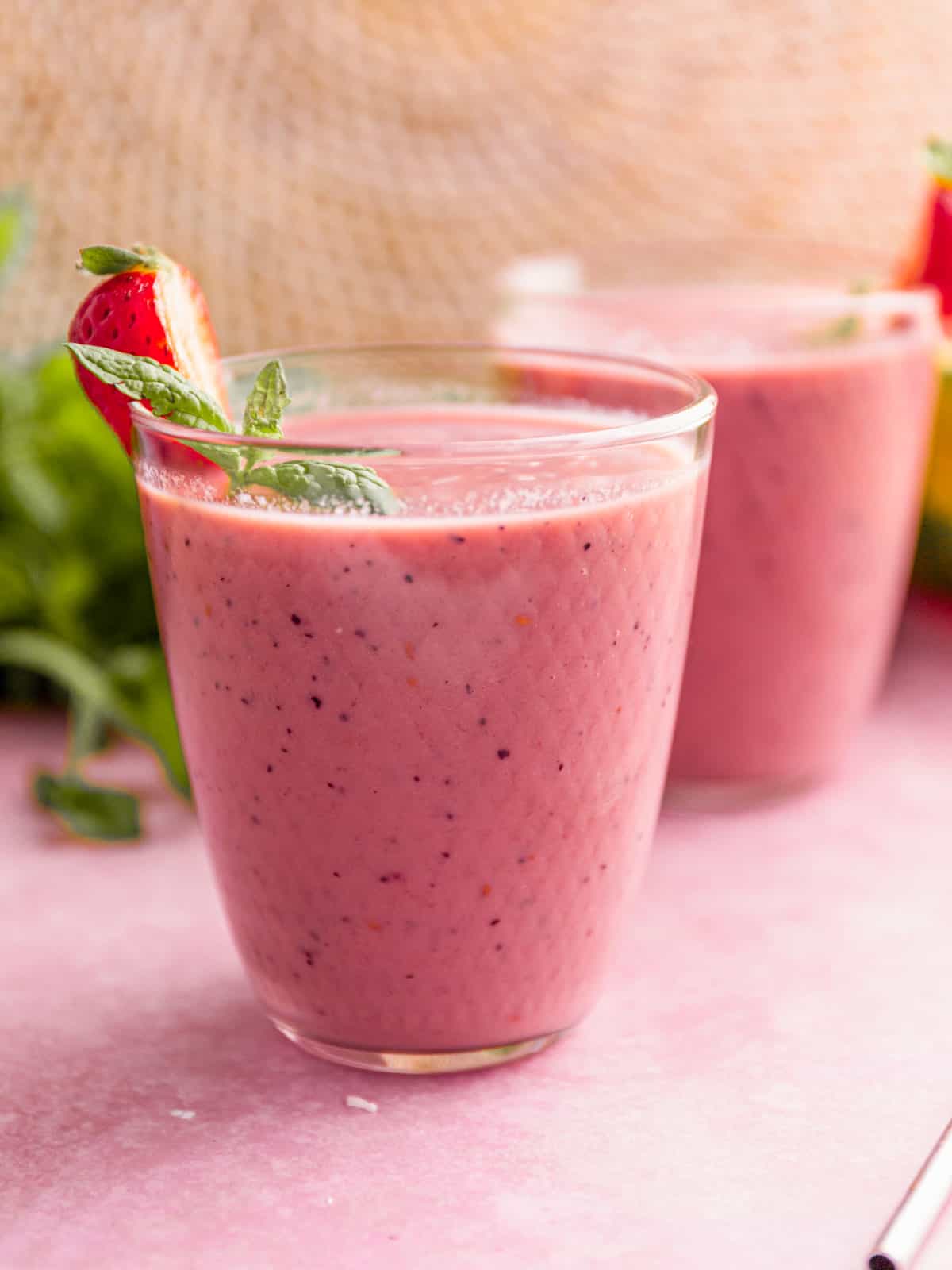 watermelon smoothie with strawberry garnish.