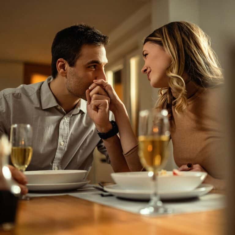 Couple enjoying dinner together at a restaurant during a date.