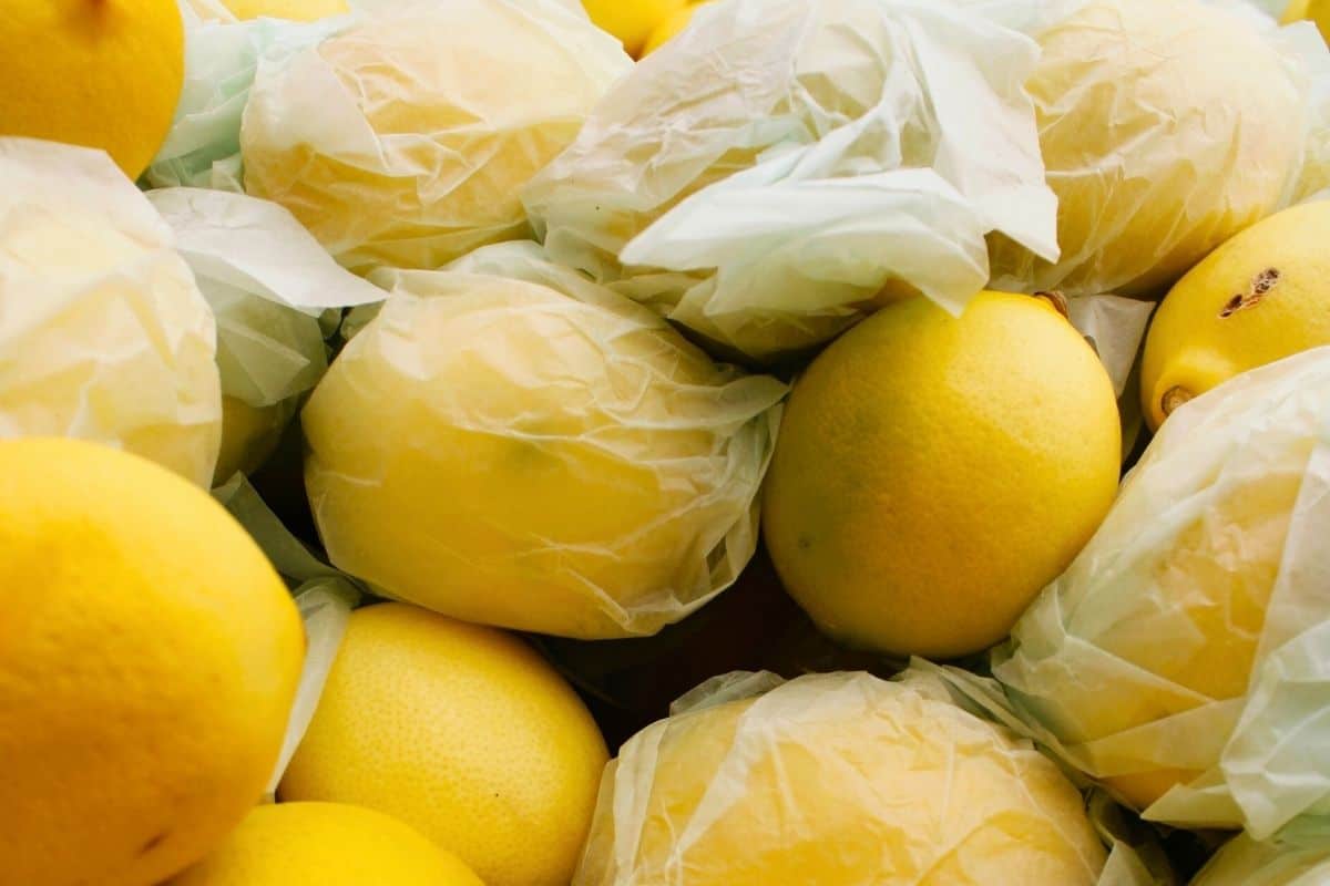 Lemons wrapped individually in paper