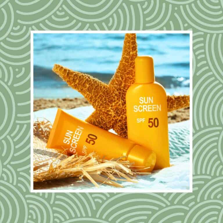 Sunscreen bottles with SPF 50 on a beach with a starfish and ocean background