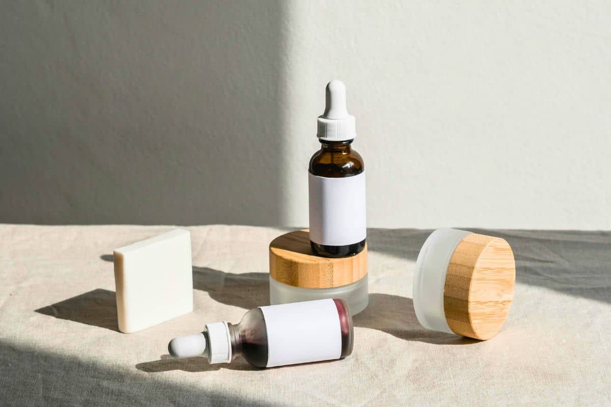 Minimal vegan skincare products on a neutral table in natural light