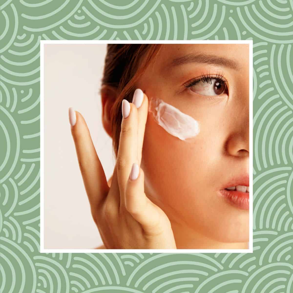Woman applying face cream for a simple skincare routine