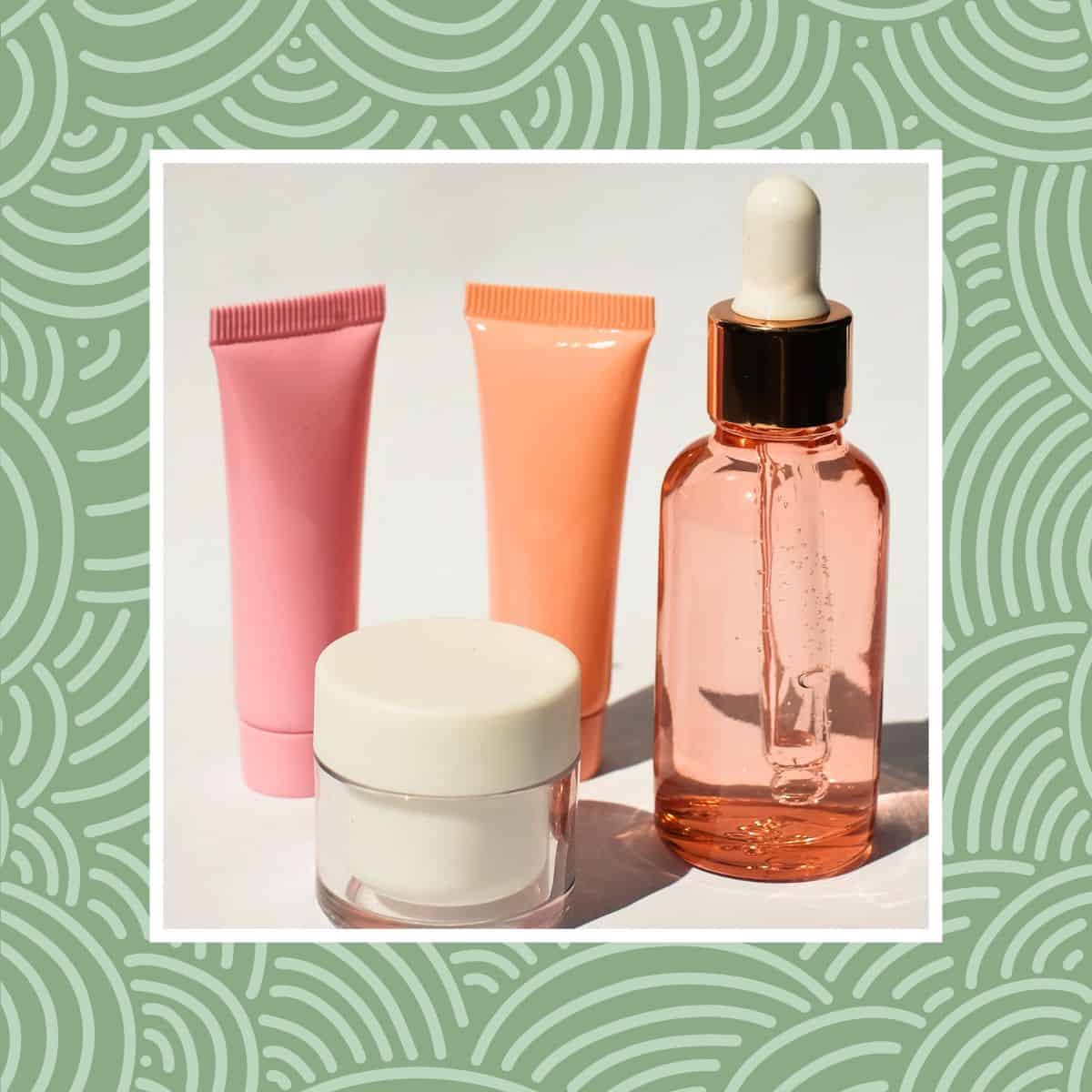 Vegan skincare products including cream jar, tubes, and serum bottle on a clean background