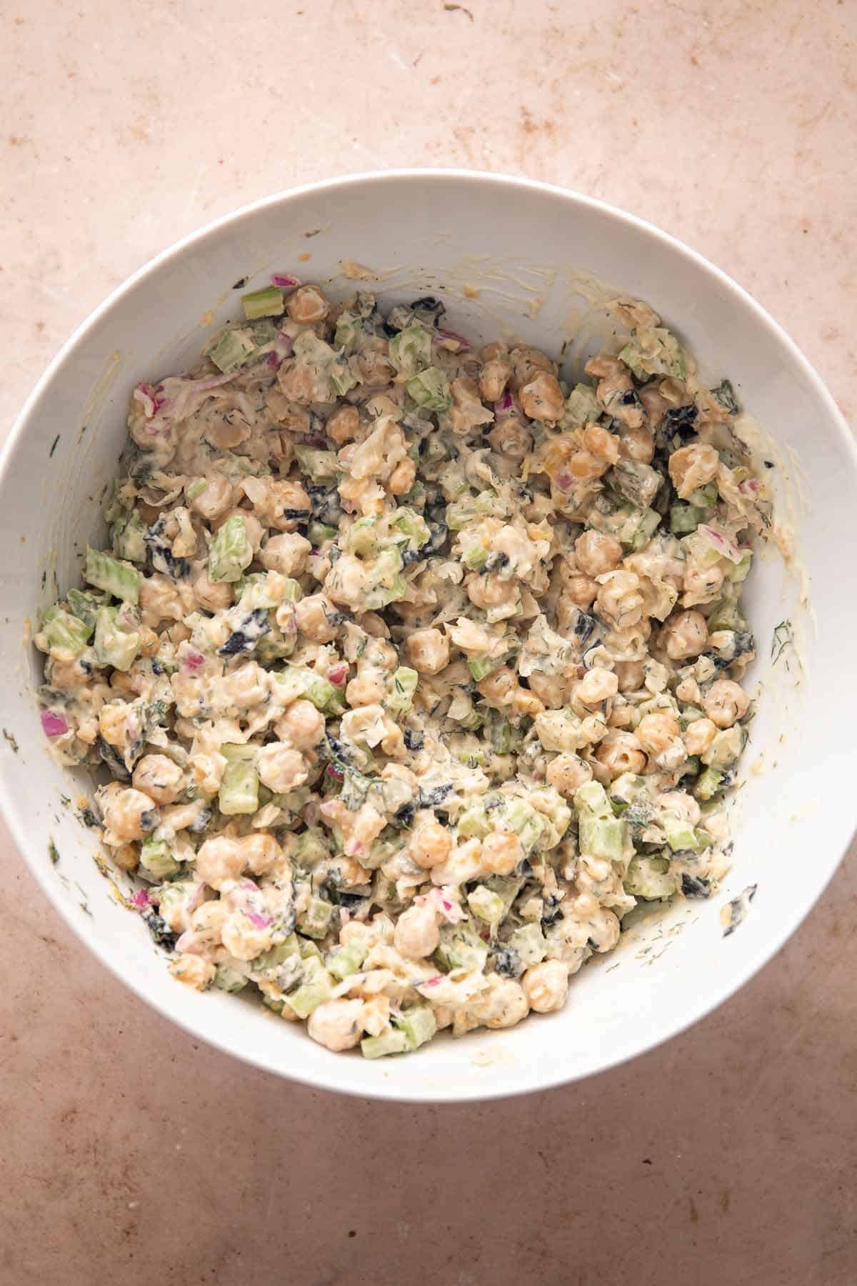 Creamy chickpea salad mixed together in a large bowl