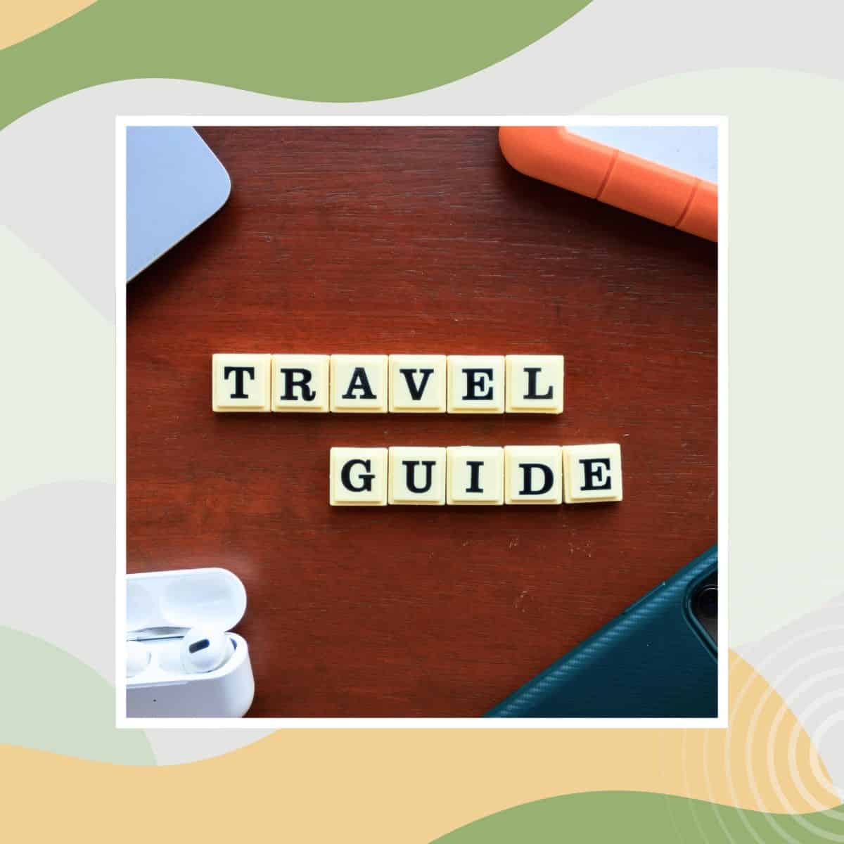 Travel guide text displayed with travel accessories on a desk